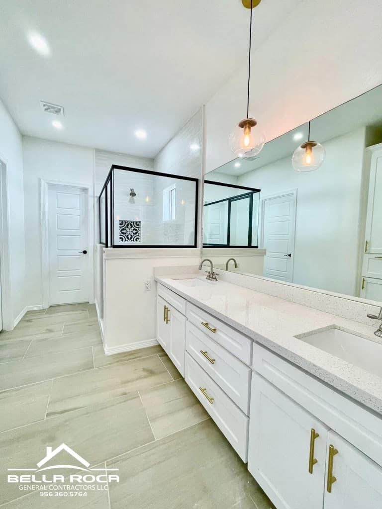 Primary bathroom with double vanity and walk-in shower